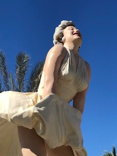 woman in white dress and smiling