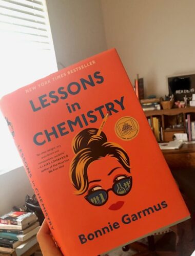 Book held up with title Lessons in Chemistry